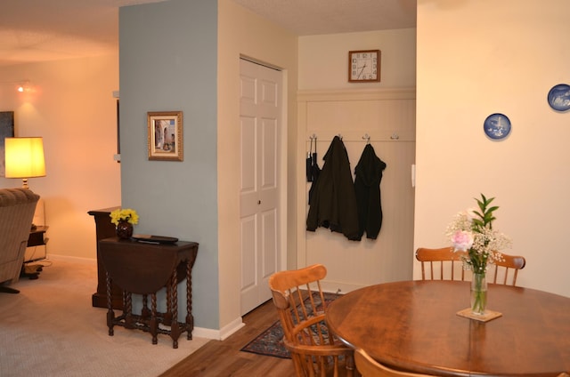 dining room with light wood-style flooring and baseboards