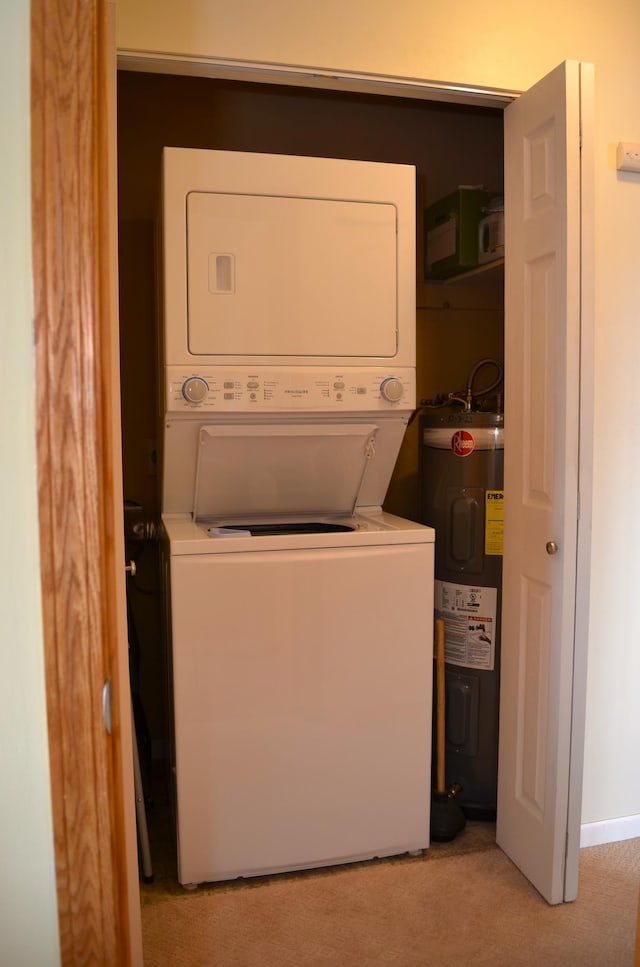 washroom with stacked washer and clothes dryer, light carpet, water heater, and laundry area