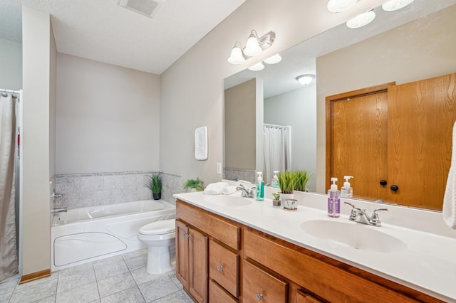 bathroom with visible vents, a sink, a garden tub, and tile patterned flooring