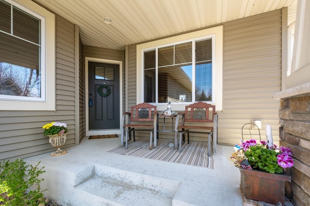 doorway to property with covered porch