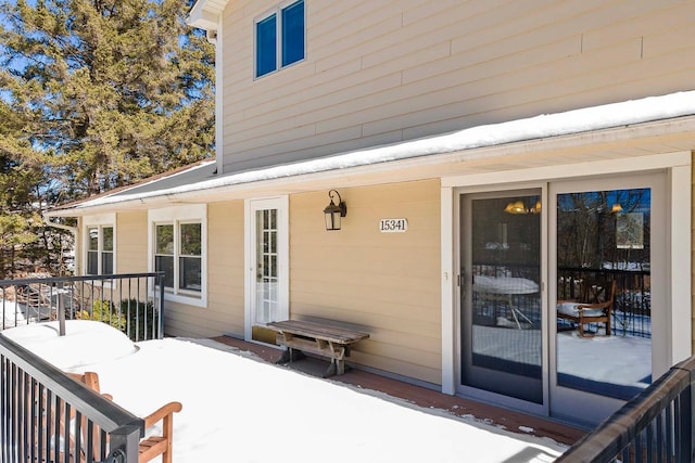 view of snow covered deck