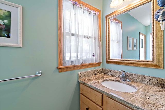 bathroom with vanity and plenty of natural light