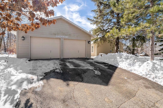 view of snow covered garage