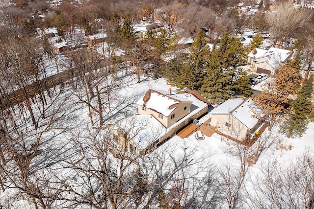 snowy aerial view with a residential view