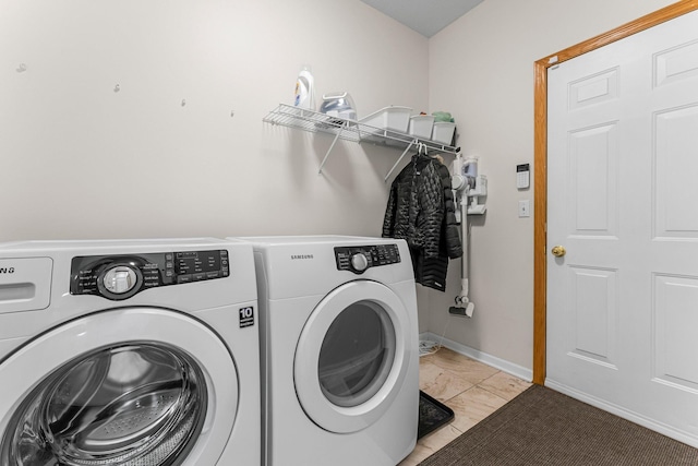 laundry area featuring laundry area, independent washer and dryer, and baseboards