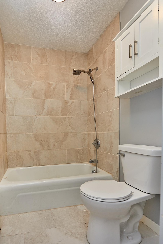 full bathroom featuring a textured ceiling, bathtub / shower combination, and toilet