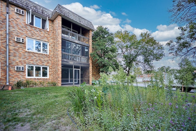 view of property with a wall mounted air conditioner