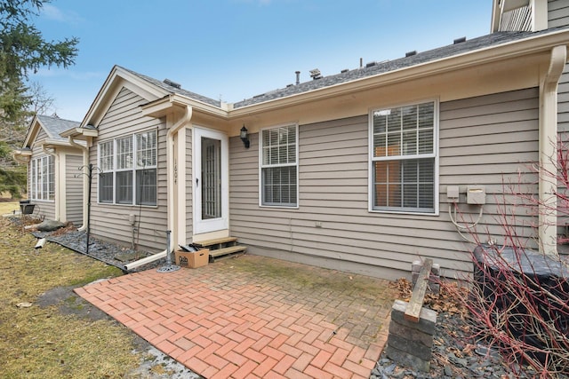 rear view of house featuring entry steps and a patio