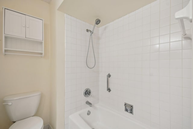 bathroom with shower / bath combination and toilet