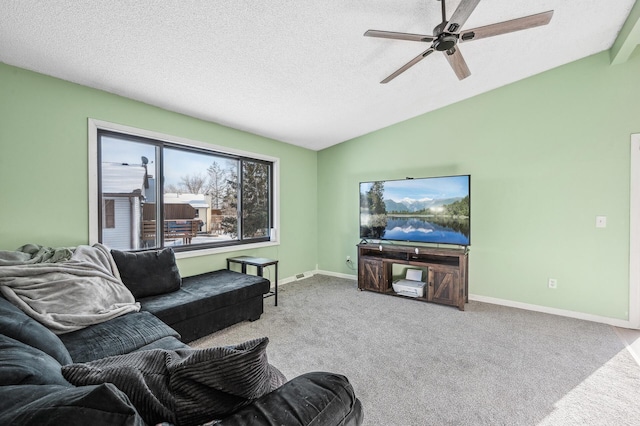 living area featuring lofted ceiling, a textured ceiling, light carpet, a ceiling fan, and baseboards