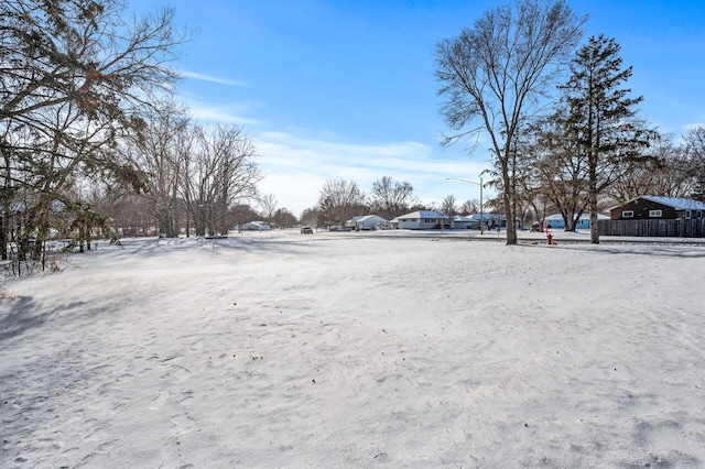 view of yard layered in snow