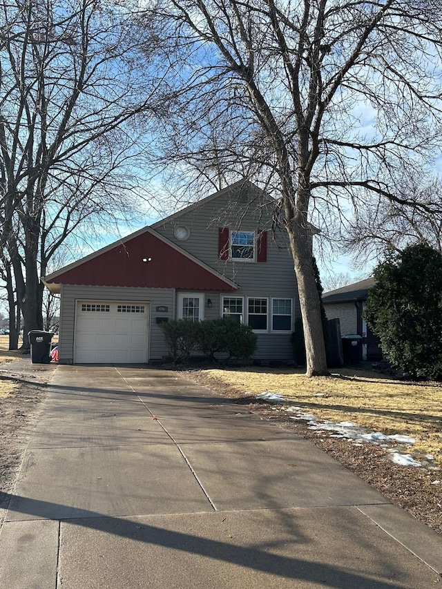 view of front of property featuring a garage and driveway