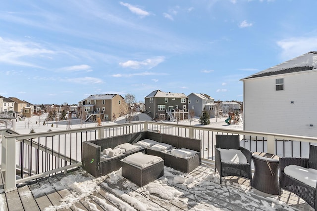 wooden terrace featuring a residential view, outdoor lounge area, and a playground