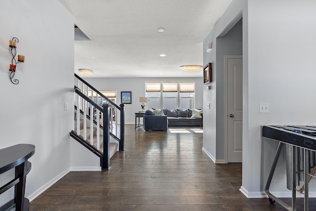 entrance foyer featuring stairs, dark wood-style flooring, recessed lighting, and baseboards