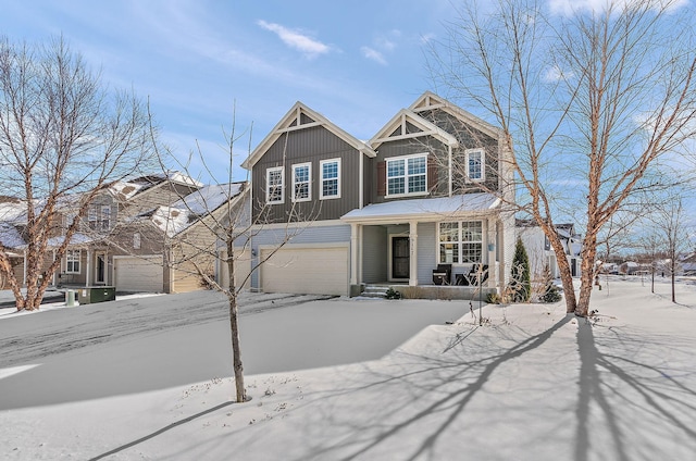 view of front of house with a garage, a porch, and board and batten siding