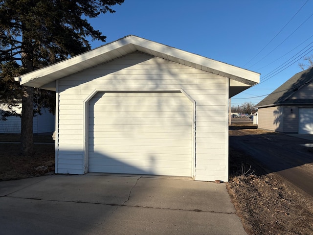 detached garage featuring driveway