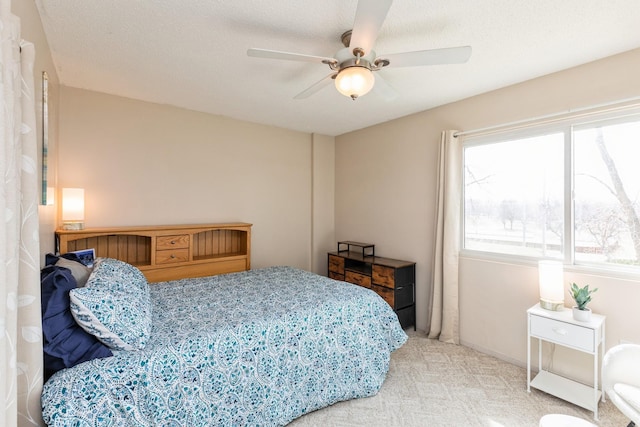 carpeted bedroom with a ceiling fan