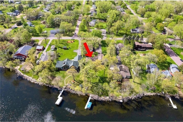 drone / aerial view featuring a residential view and a water view