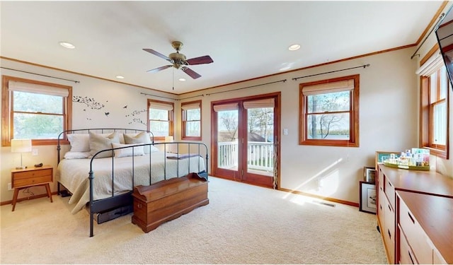 bedroom featuring access to outside, multiple windows, crown molding, and light carpet