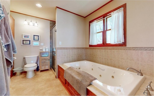 bathroom featuring toilet, a whirlpool tub, tile patterned flooring, crown molding, and a shower stall