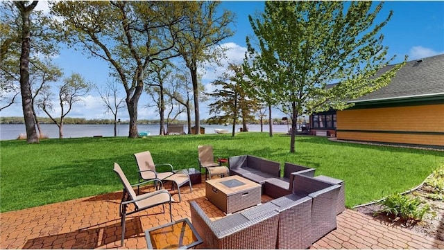 view of patio / terrace with a water view and an outdoor living space with a fire pit