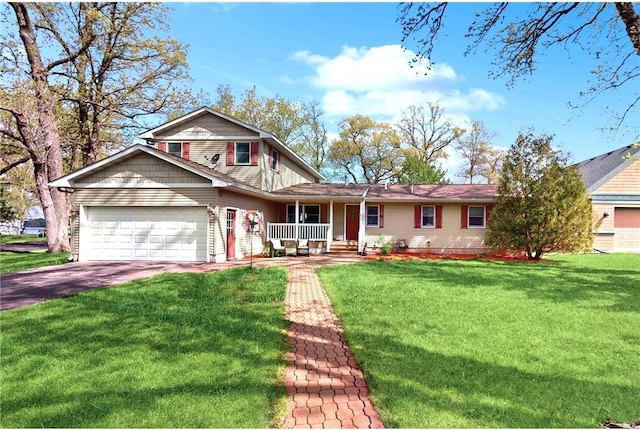 view of front facade featuring covered porch, driveway, a front lawn, and an attached garage