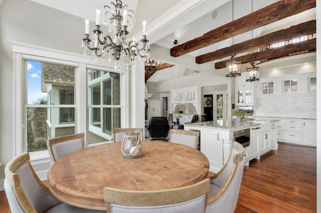 dining area with a chandelier, plenty of natural light, dark wood-style floors, and beam ceiling