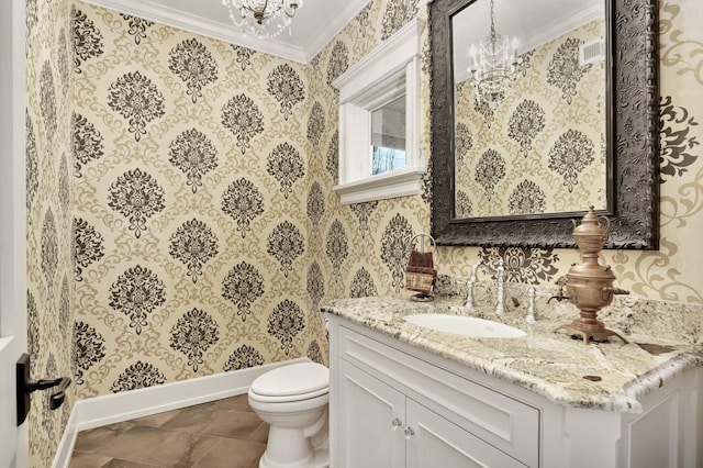 bathroom with toilet, wallpapered walls, ornamental molding, and a notable chandelier