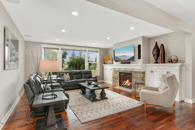 living room with recessed lighting, a fireplace, dark wood finished floors, and baseboards