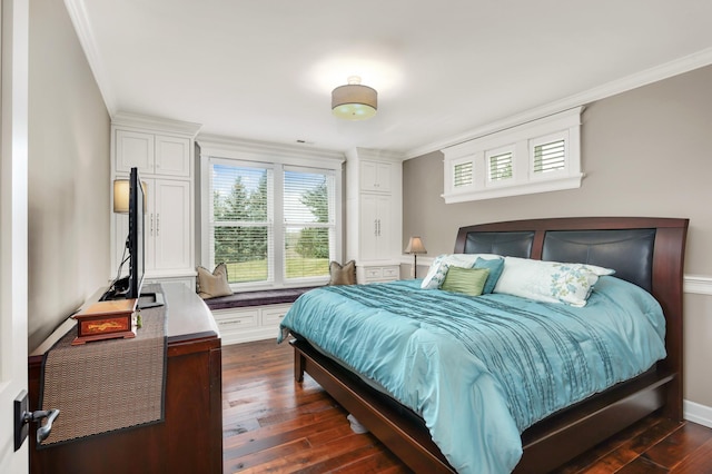 bedroom featuring ornamental molding, dark wood-type flooring, and baseboards