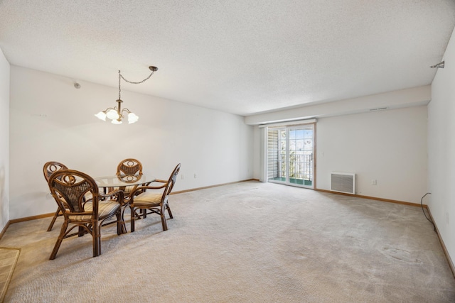 dining space with light colored carpet, baseboards, and an inviting chandelier