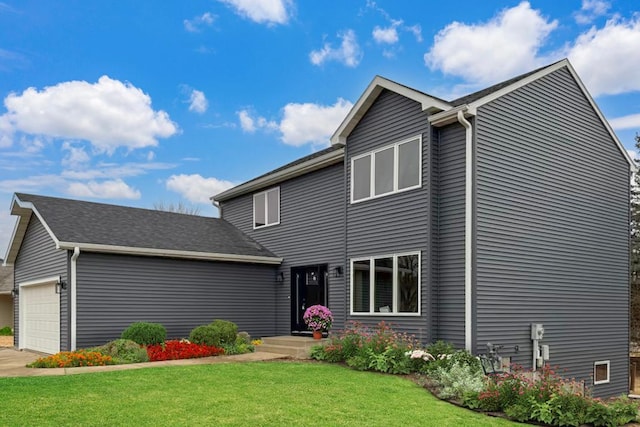 traditional home with driveway, a front lawn, and an attached garage