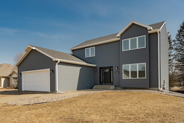 traditional-style home with a garage and concrete driveway