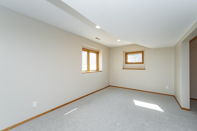 spare room featuring recessed lighting, visible vents, baseboards, and light colored carpet