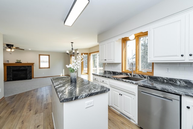 2511 Mayowood Ln SW, Rochester, MN 55902 - kitchen featuring stainless steel dishwasher, a sink, plenty of natural light, and a kitchen island