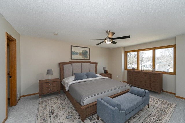 2511 Mayowood Ln SW, Rochester, MN 55902 - bedroom featuring baseboards, light carpet, a ceiling fan, and a textured ceiling