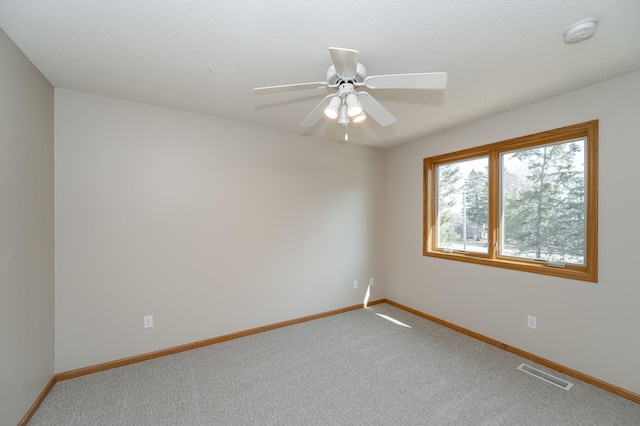 2511 Mayowood Ln SW, Rochester, MN 55902 - spare room with a smoke detector, baseboards, carpet floors, and a ceiling fan