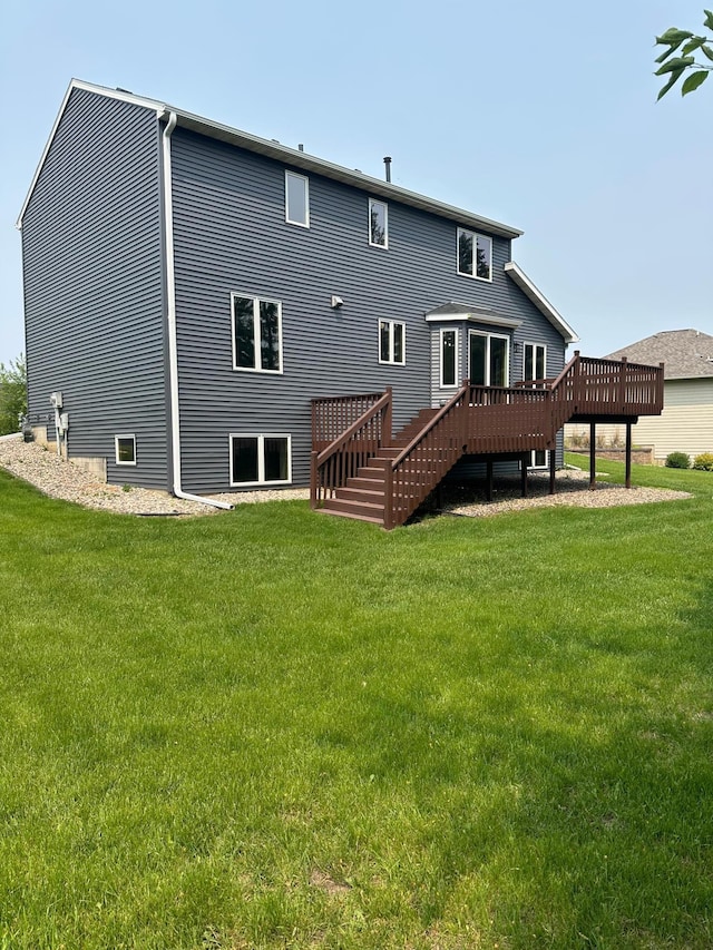 2511 Mayowood Ln SW, Rochester, MN 55902 - rear view of house with a deck, a yard, and stairway