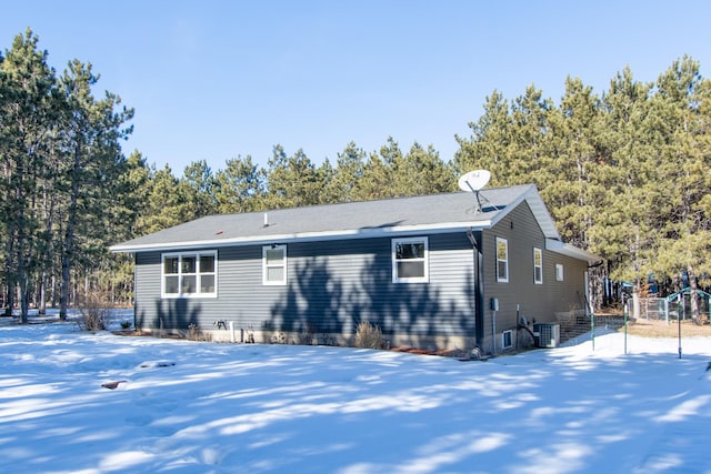 back of property featuring central AC