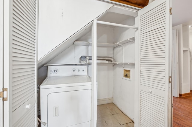 laundry room featuring washer / dryer and laundry area