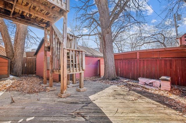 wooden terrace featuring a fenced backyard