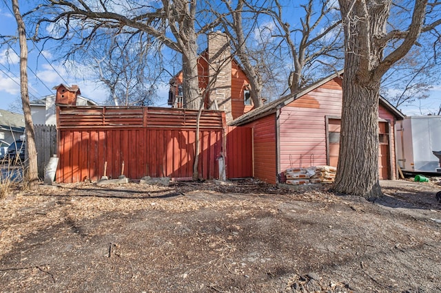 exterior space with a garage and fence