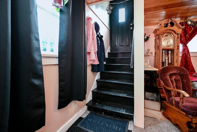 stairway featuring wood ceiling