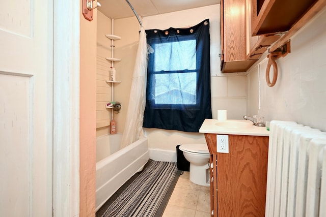 full bathroom featuring toilet, radiator heating unit, shower / bath combo with shower curtain, vanity, and tile patterned flooring