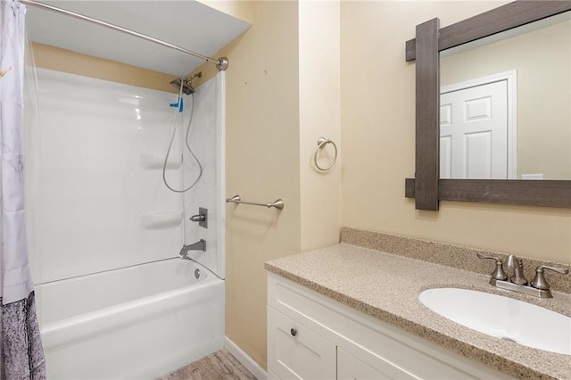 full bath featuring shower / bath combo with shower curtain and vanity