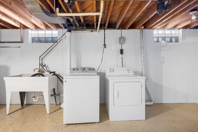 laundry room with laundry area and washing machine and clothes dryer