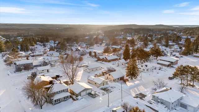 snowy aerial view featuring a residential view