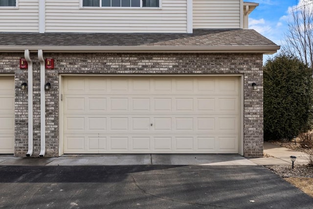 garage featuring driveway