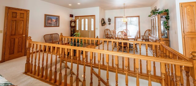 interior space with an inviting chandelier, carpet flooring, and recessed lighting