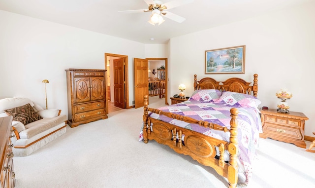 bedroom with ceiling fan and light colored carpet